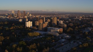 5.7K aerial stock footage ascend for stationary view of apartment buildings at sunrise in Denver, Colorado Aerial Stock Footage | DX0001_001401