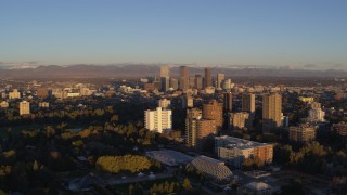 5.7K aerial stock footage of downtown skyscrapers seen from apartment complexes at sunrise, Downtown Denver, Colorado Aerial Stock Footage | DX0001_001403