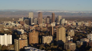 5.7K aerial stock footage of skyscrapers in Downtown Denver, Colorado at sunrise, seen while flying by apartment buildings Aerial Stock Footage | DX0001_001414