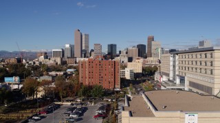 DX0001_001439 - 5.7K aerial stock footage of skyscrapers in Downtown Denver, Colorado, seen while descending near apartment building