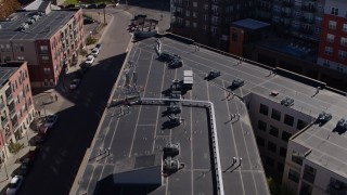 5.7K aerial stock footage of flying over apartment building rooftop in Downtown Denver, Colorado Aerial Stock Footage | DX0001_001489