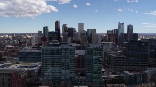 5.7K aerial stock footage of the city's skyline seen while passing office buildings in Downtown Denver, Colorado Aerial Stock Footage | DX0001_001497