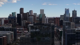 5.7K aerial stock footage of the city's skyline seen during descent by office building in Downtown Denver, Colorado Aerial Stock Footage | DX0001_001510