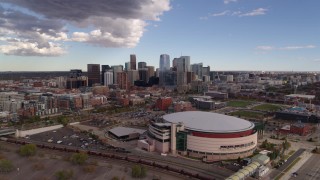 5.7K aerial stock footage of the city skyline seen from while flying by arena, Downtown Denver, Colorado Aerial Stock Footage | DX0001_001534