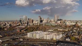 5.7K aerial stock footage of the city skyline seen while flying away from W Colfax Avenue, Downtown Denver, Colorado Aerial Stock Footage | DX0001_001545