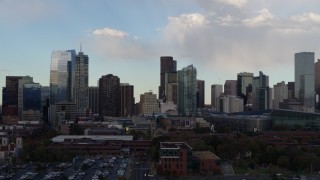 5.7K aerial stock footage of passing the city skyline with clouds overhead, Downtown Denver, Colorado Aerial Stock Footage | DX0001_001550