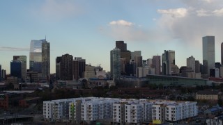 5.7K aerial stock footage of tall skyscrapers in the city skyline with clouds in the sky, Downtown Denver, Colorado Aerial Stock Footage | DX0001_001552