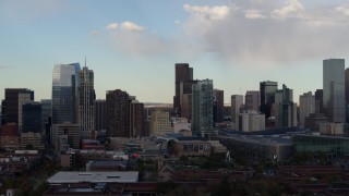 5.7K aerial stock footage flyby tall skyscrapers in the city skyline with clouds in the sky, Downtown Denver, Colorado Aerial Stock Footage | DX0001_001553