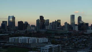 5.7K aerial stock footage of slowly passing by the city's skyline at sunset, Downtown Denver, Colorado Aerial Stock Footage | DX0001_001565