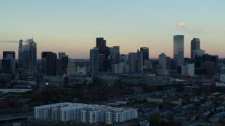 5.7K aerial stock footage fly away from the city's skyline at sunset before descent, Downtown Denver, Colorado Aerial Stock Footage | DX0001_001571