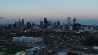 5.7K aerial stock footage fly away from and flyby the city's downtown skyline at sunset, Downtown Denver, Colorado Aerial Stock Footage | DX0001_001579