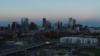 5.7K aerial stock footage of the city's downtown skyline at sunset, seen from W Colfax Ave, Downtown Denver, Colorado Aerial Stock Footage | DX0001_001581