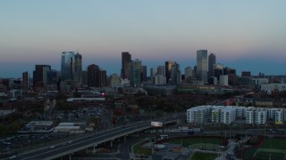 5.7K aerial stock footage flyby the city's downtown skyline at sunset, seen while descending, Downtown Denver, Colorado Aerial Stock Footage | DX0001_001582