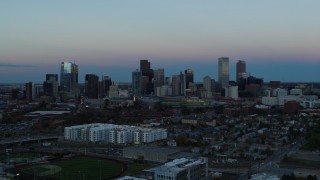 5.7K aerial stock footage flyby the city's downtown skyline at sunset, seen while ascending, Downtown Denver, Colorado Aerial Stock Footage | DX0001_001583