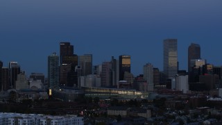 5.7K aerial stock footage of flying by the city's downtown skyscrapers by convention center at twilight, Downtown Denver, Colorado Aerial Stock Footage | DX0001_001589