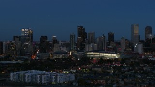 5.7K aerial stock footage passing the city's skyscrapers and convention center at twilight, Downtown Denver, Colorado Aerial Stock Footage | DX0001_001597