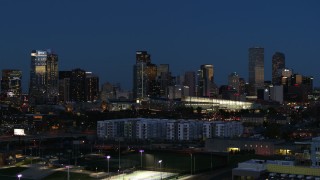 5.7K aerial stock footage of the convention center and city skyline at twilight during slow descent, Downtown Denver, Colorado Aerial Stock Footage | DX0001_001604