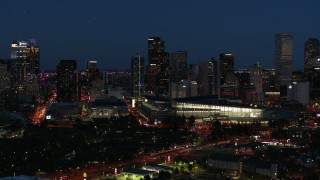 5.7K aerial stock footage of the city skyline behind the convention center at twilight, Downtown Denver, Colorado Aerial Stock Footage | DX0001_001607