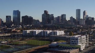 5.7K aerial stock footage of the city's skyline at sunrise while descending in Downtown Denver, Colorado Aerial Stock Footage | DX0001_001657