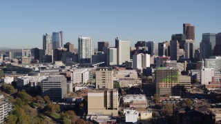 5.7K aerial stock footage of the city's skyline behind office buildings in Downtown Denver, Colorado Aerial Stock Footage | DX0001_001659