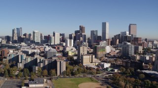 5.7K aerial stock footage of flyby the city's skyline descend behind office buildings, Downtown Denver, Colorado Aerial Stock Footage | DX0001_001677