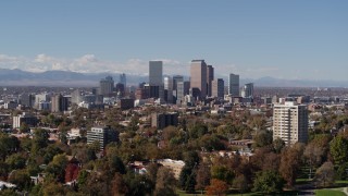 5.7K aerial stock footage of the city's skyline with mountains in the background, seen during descent, Downtown Denver, Colorado Aerial Stock Footage | DX0001_001722