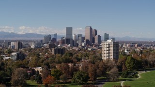 5.7K aerial stock footage of the city's skyline, mountains in distance, seen while descending, Downtown Denver, Colorado Aerial Stock Footage | DX0001_001730