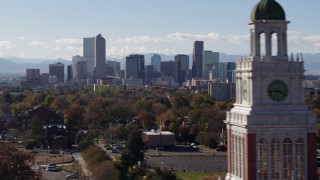 5.7K aerial stock footage of the city's skyline with Rockies in the background, pause for stationary view, Downtown Denver, Colorado Aerial Stock Footage | DX0001_001751