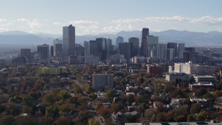 5.7K aerial stock footage of flying by the city's skyline with Rockies in the background, Downtown Denver, Colorado Aerial Stock Footage | DX0001_001754