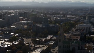 DX0001_001779 - 5.7K aerial stock footage flyby Colorado State Capitol, Denver City Council and cathedral while ascending in Downtown Denver, Colorado