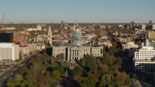 5.7K aerial stock footage slowly ascend to view the Colorado State Capitol and tree-lined park in Downtown Denver, Colorado Aerial Stock Footage | DX0001_001787