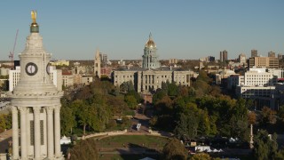 DX0001_001793 - 5.7K aerial stock footage focus on the Colorado State Capitol, reveal clock tower in Downtown Denver, Colorado