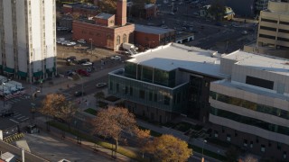 5.7K aerial stock footage of orbiting the side of a police crime lab and descend in Downtown Denver, Colorado Aerial Stock Footage | DX0001_001803