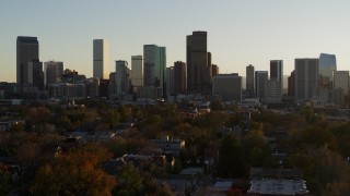 5.7K aerial stock footage of a reverse view of the city skyline at sunset, Downtown Denver, Colorado Aerial Stock Footage | DX0001_001820