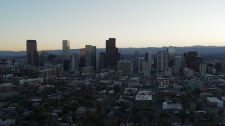 5.7K aerial stock footage of passing by the city skyline while ascending at sunset, Downtown Denver, Colorado Aerial Stock Footage | DX0001_001831