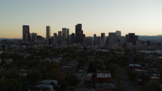 5.7K aerial stock footage fly toward the city skyline at sunset during ascent, Downtown Denver, Colorado Aerial Stock Footage | DX0001_001841