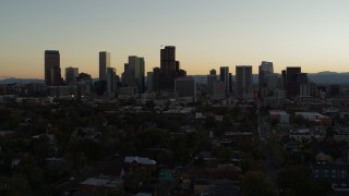 5.7K aerial stock footage of flying by the city's skyline at sunset and descending in Downtown Denver, Colorado Aerial Stock Footage | DX0001_001847