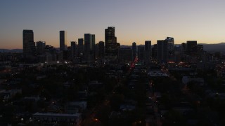 5.7K aerial stock footage of passing the city's skyline at twilight, Downtown Denver, Colorado Aerial Stock Footage | DX0001_001871