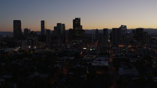 5.7K aerial stock footage of a slow descent while focusing on the city's skyline at twilight, Downtown Denver, Colorado Aerial Stock Footage | DX0001_001874