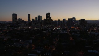 5.7K aerial stock footage of a reverse view of the city's skyline at twilight and ascend, Downtown Denver, Colorado Aerial Stock Footage | DX0001_001876