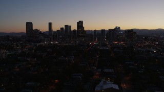 5.7K aerial stock footage of a slow descent while viewing the city's skyline at twilight, Downtown Denver, Colorado Aerial Stock Footage | DX0001_001877