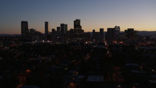 5.7K aerial stock footage of a reverse view of the city's skyline at twilight, Downtown Denver, Colorado Aerial Stock Footage | DX0001_001885