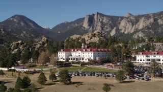 DX0001_001962 - 5.7K aerial stock footage of the historic Stanley Hotel in Estes Park, Colorado, mountains in background