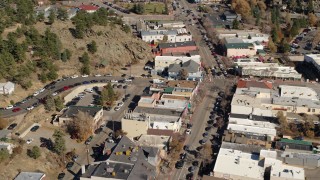 5.7K aerial stock footage slow reverse view of shops on road through Estes Park, Colorado Aerial Stock Footage | DX0001_001990