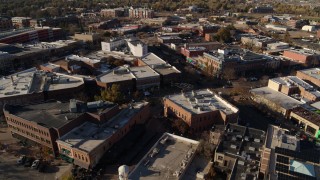 5.7K aerial stock footage of a reverse view of brick office buildings and shops in Fort Collins, Colorado Aerial Stock Footage | DX0001_002010