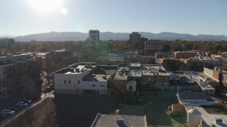 5.7K aerial stock footage flyby shops with view of taller office buildings in Fort Collins, Colorado Aerial Stock Footage | DX0001_002023