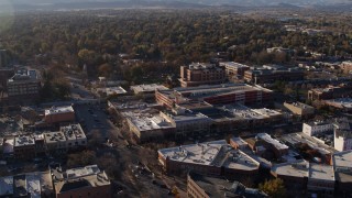 DX0001_002038 - 5.7K aerial stock footage fly away from office buildings, shops, parking garage in Fort Collins, Colorado