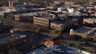 5.7K aerial stock footage of a view of brick office buildings and street level shops in Fort Collins, Colorado Aerial Stock Footage | DX0001_002044