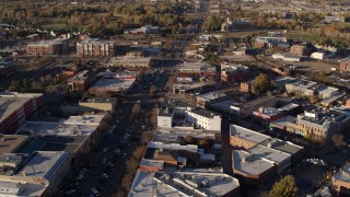 DX0001_002053 - 5.7K aerial stock footage of shops and office buildings around wide street in Fort Collins, Colorado