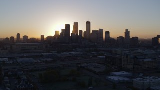 5.7K aerial stock footage of the city's skyline as the sun rises in Downtown Minneapolis, Minnesota during descent Aerial Stock Footage | DX0001_002067